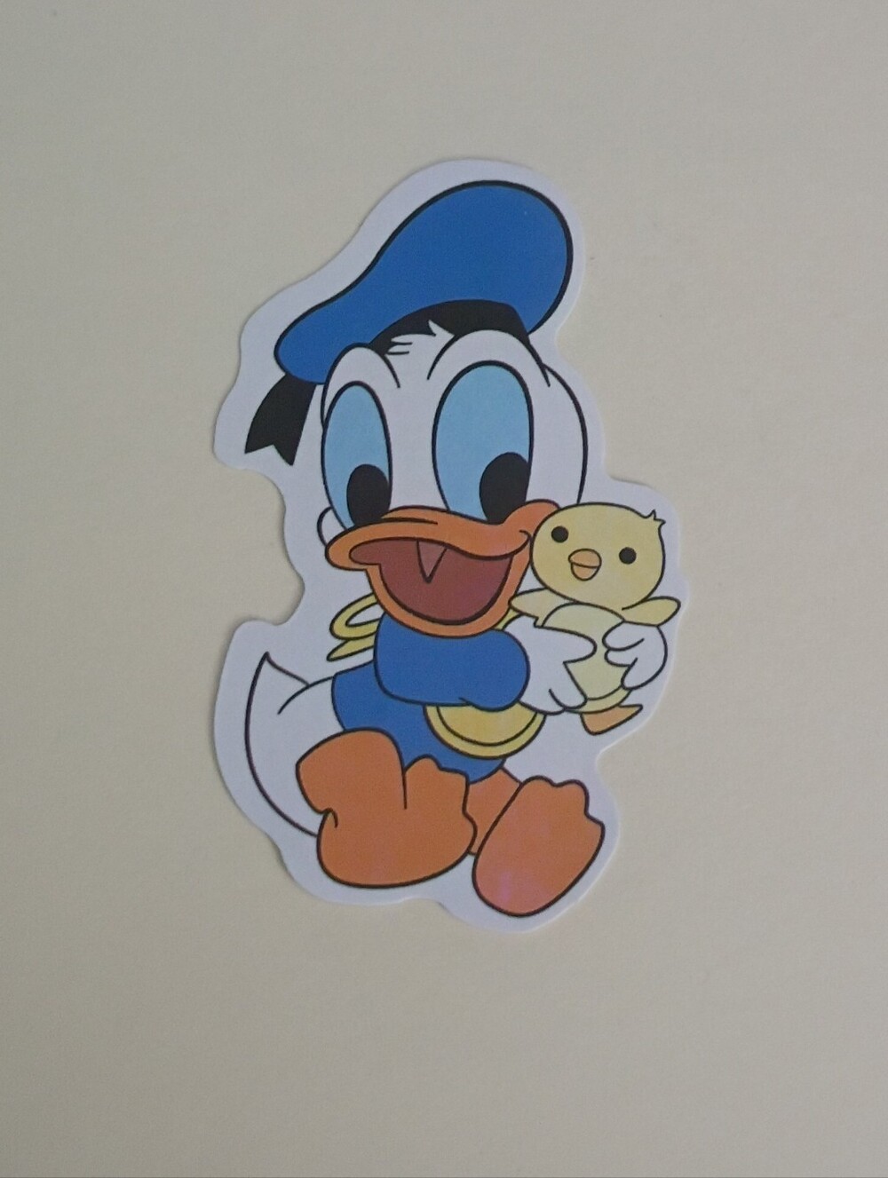 10/$10 Sticker - Disney Mickey & Friends - Baby Donald Duck Holding Yellow Chick